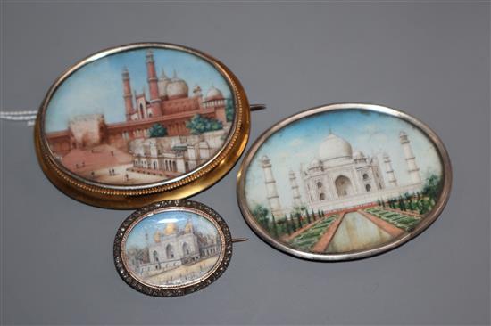 Three Indian miniatures, mounted in white or yellow metal mounts, one with rose cut diamond border, largest 67mm.